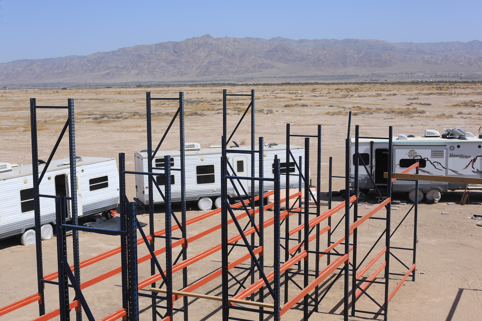 Construction of pallet rack structures in the desert.