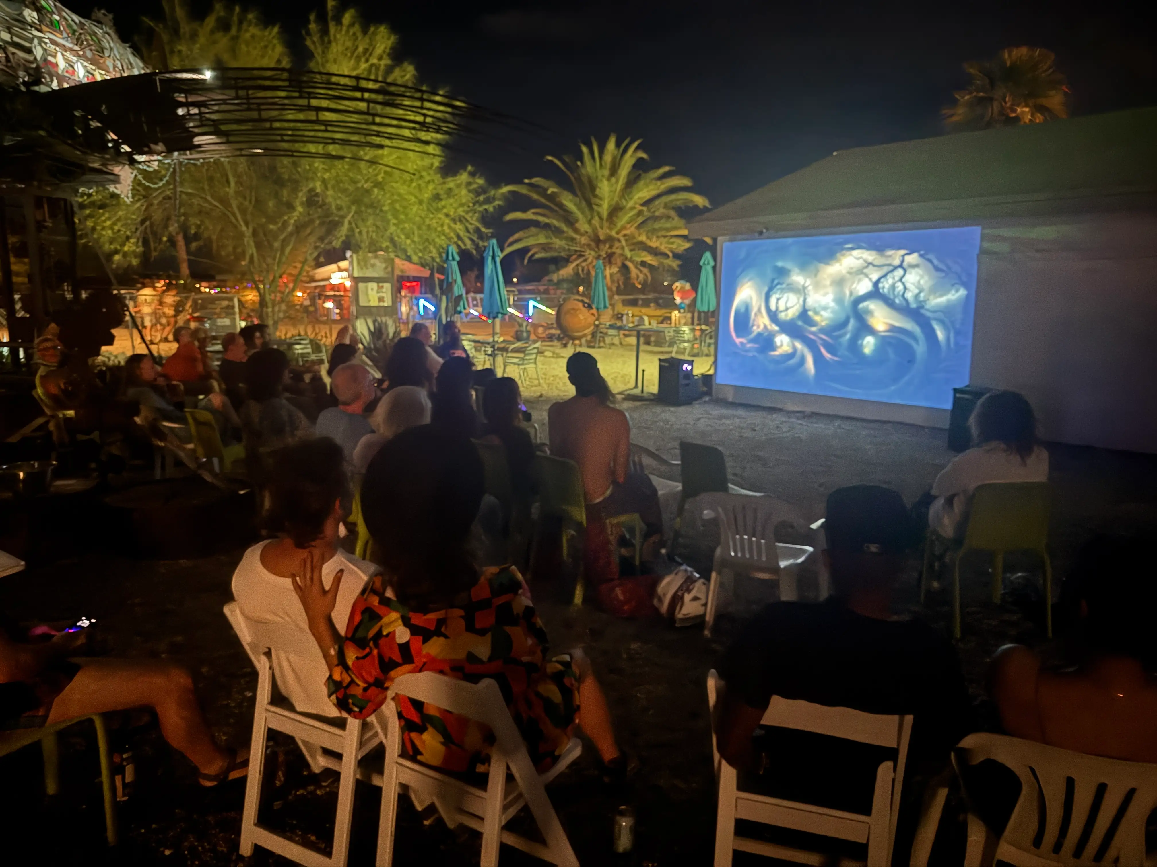 An AI art film screening outdoors at night · 2026