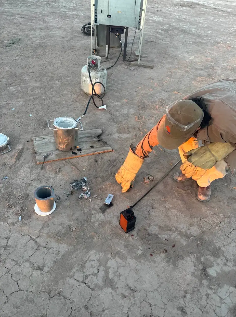 Pouring molten metal at an outdoor foundry