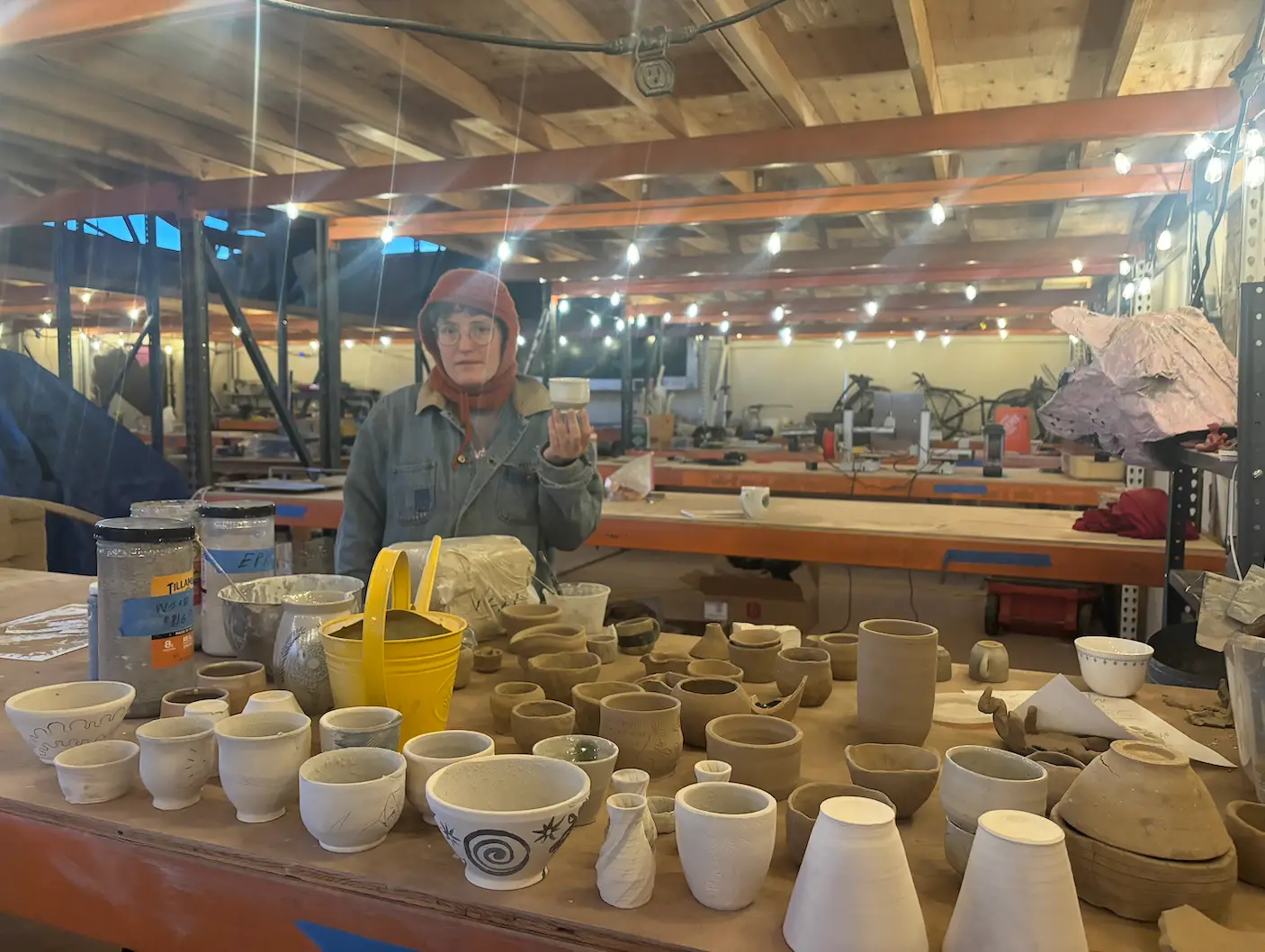 Greenware drying on the shelves of the ceramics studio