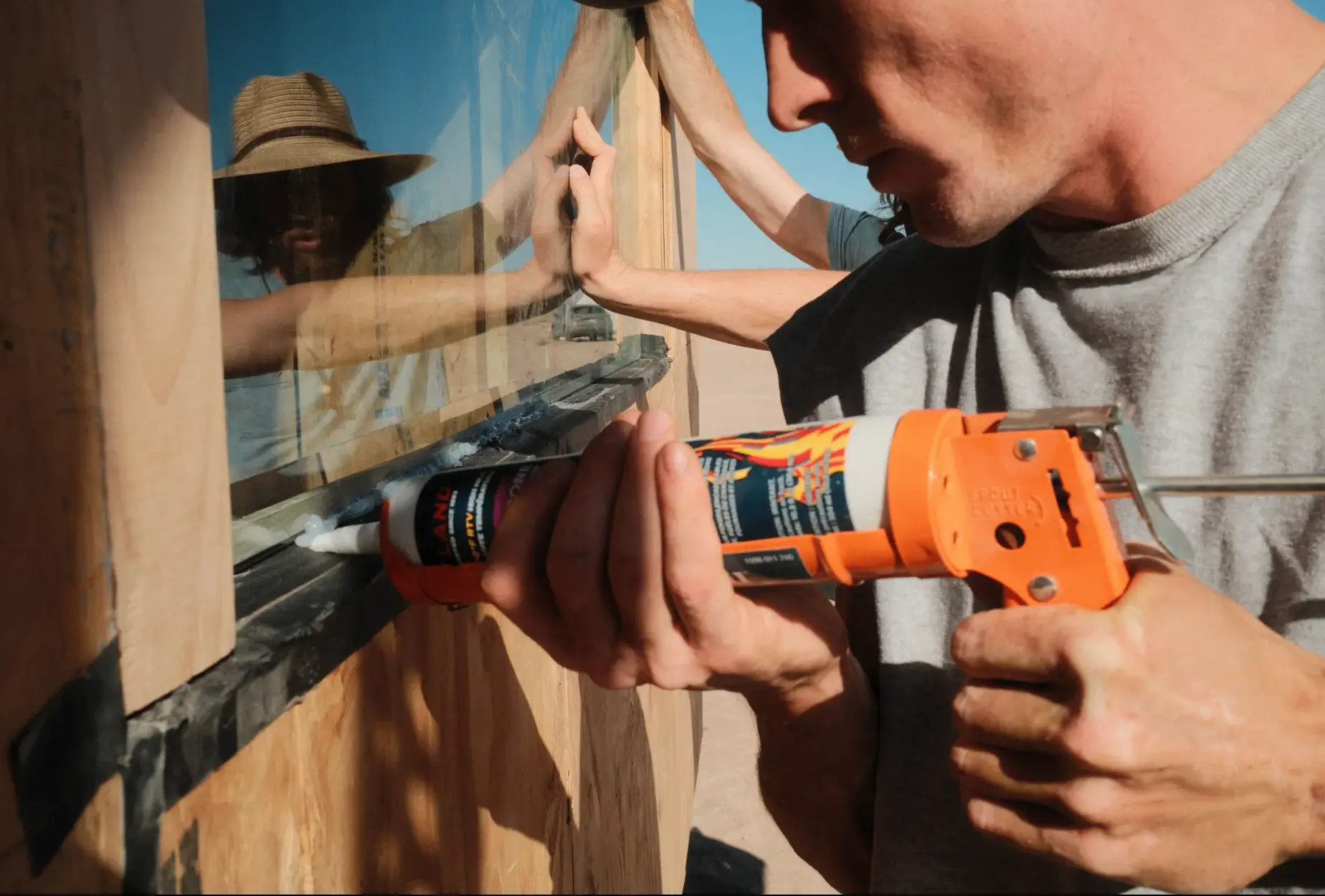Sealing a window into a plywood wall with a drill