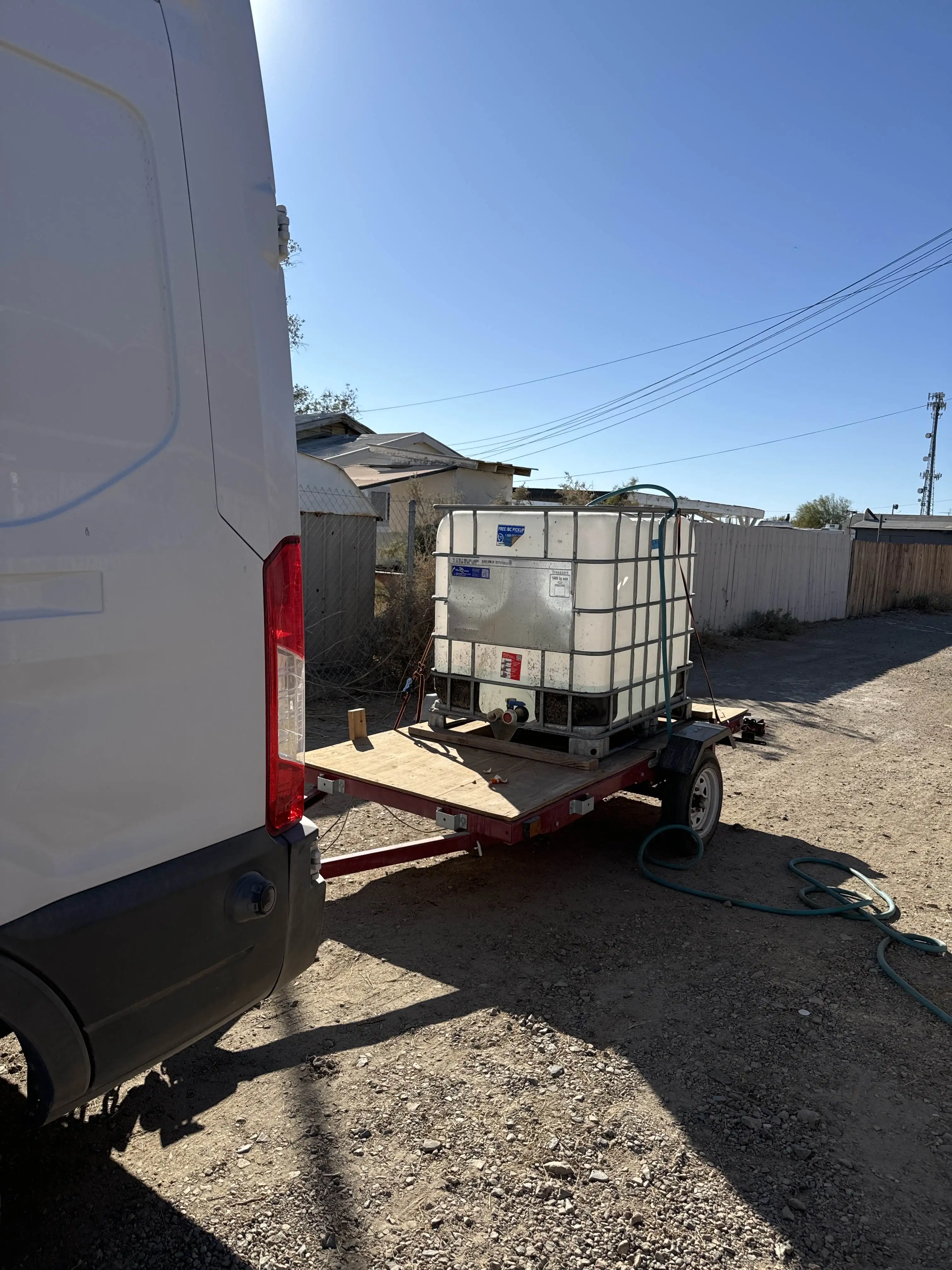 An IBC water tank hauled on a trailer